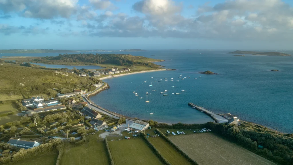 Tresco from the air, with the harbour, moorings and the islands beyond